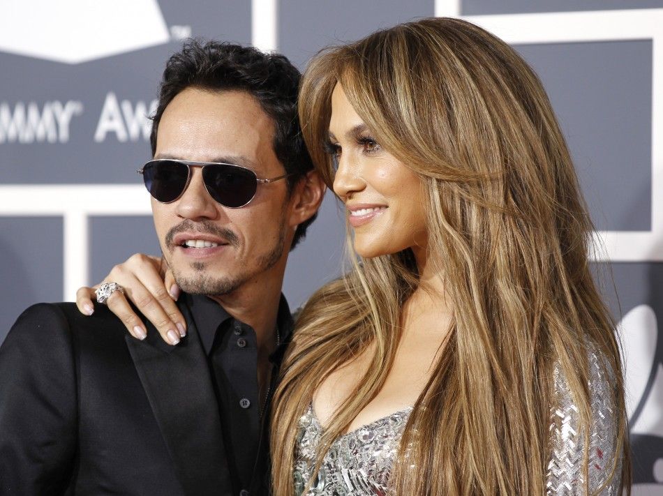 Jennifer Lopez and Marc Anthony pose on arrival at the 53rd annual Grammy Awards in Los Angeles