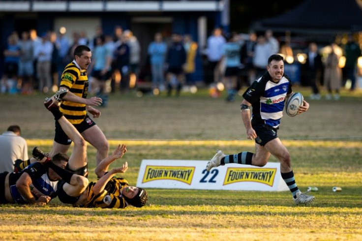Sydney Convicts' Pat Mobbs shows the opposition a clean pair of heels as he sprints for the line