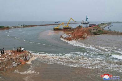 Storm damage to an embankment resulted in seawater flooding hundreds of hectares of land, including rice paddies, KCNA reported