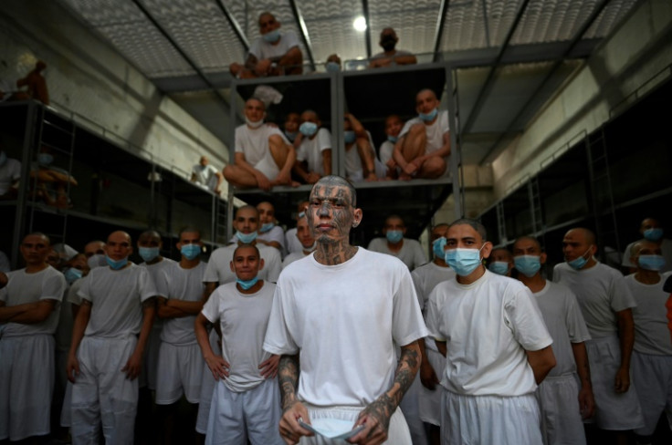 Inmates in El Salvador's new mega prison peer out from a cell