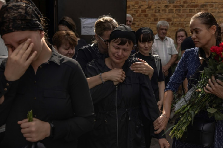 Anger and tears: Olena grieved for her son, 22-year-old Nazar Yushchenko, killed by a Russian strike on the northern city of Chernihiv