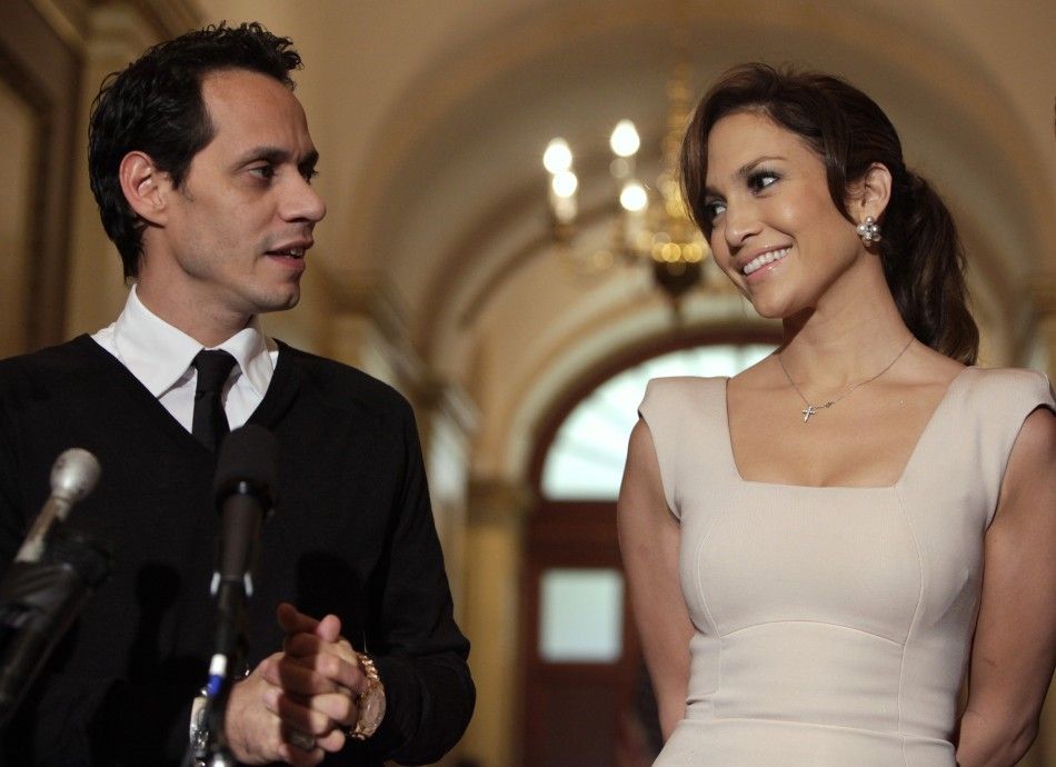 Actress Jennifer Lopez and her husband singer Marc Anthony face reporters before a meeting with House Speaker Pelosi