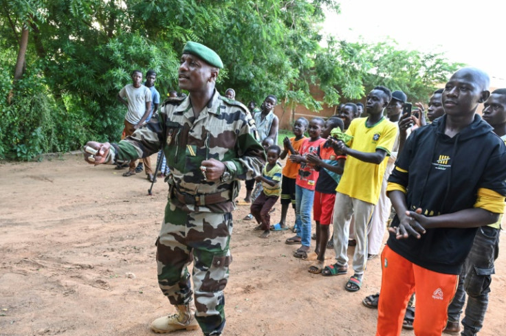 Niger army sergeant and singer Maman Sani Maigochi launches into a new song at the recording of a video clip