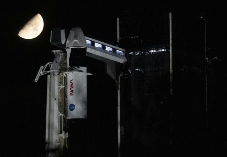 A SpaceX Falcon 9 rocket with the company's Crew Dragon spacecraft on top is seen on the launch pad at Launch Complex 39A, at NASA's Kennedy Space Center in Florida