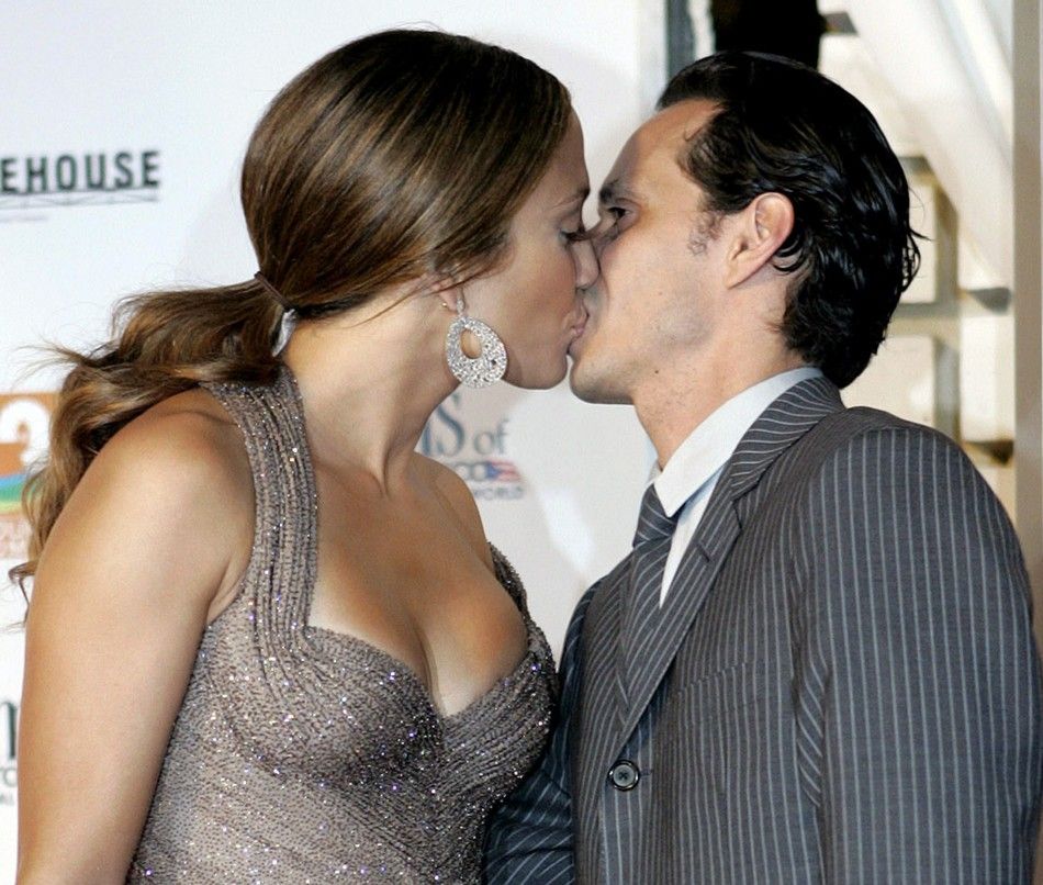 Jennifer Lopez and her husband Marc Anthony kiss as they arrive at the world premiere of their movie El Cantante at the Raul Julia Theater in the Puerto Rico Art Museum in San Juan