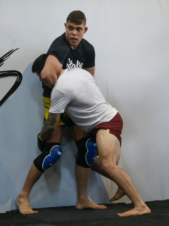 MMA fighter Caio 'The Natural' Borralho (top), grapples with an opponent