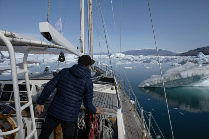 David Delample, captain of the "Kamak", as the ship navigates icebergs in Scoresby Fjord