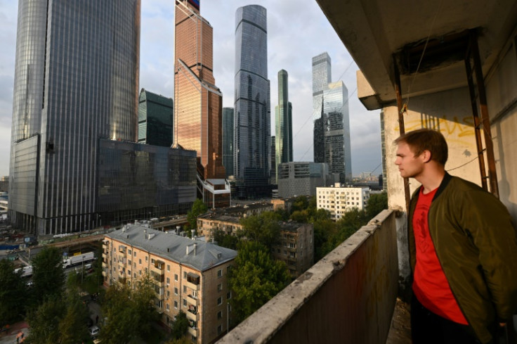 A man looks at a damaged building of the Moscow International Business Center following a drone attack in Moscow