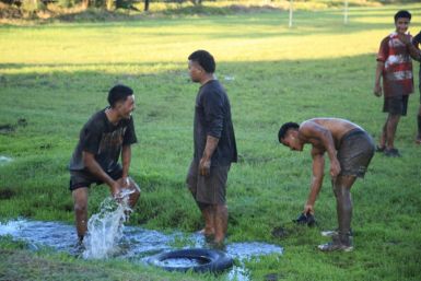 Time to cool down and clean up after a muddy training session at Apifo'ou College
