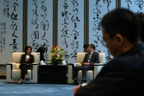US Commerce Secretary Gina Raimondo (L) talks with Shanghai Party Secretary Chen Jining during a meeting in Shanghai on August 30, 2023.