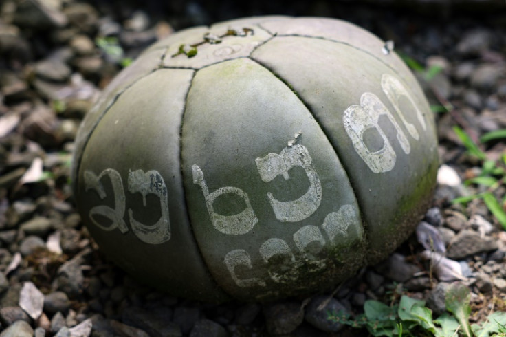 A Lelo Burti ball rests on a grave at a local cemetery in the village of Shukhuti