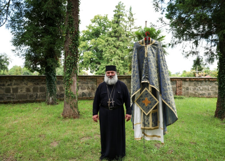 The Shukhuti priest Father Saba (Zaza Zghenti) starts Lelo Burti games by throwing the ball into the crowd