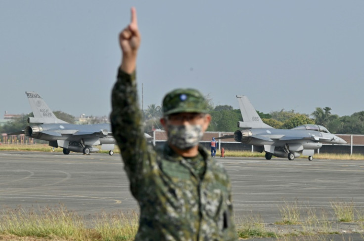 Two US-made F-16 V jet fighters are seen on the runway at an air force base in Taiwan's Chiayi county on March 25, 2023