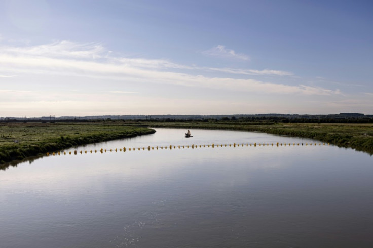 Set up on August 10 near the La Canche estuary, a floating barrier is designed to halt so-called 'taxi boats'