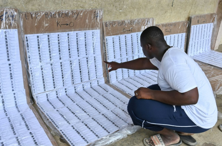 A voter checks for his name on the voters roll in the Abidjan suburb of Abobo