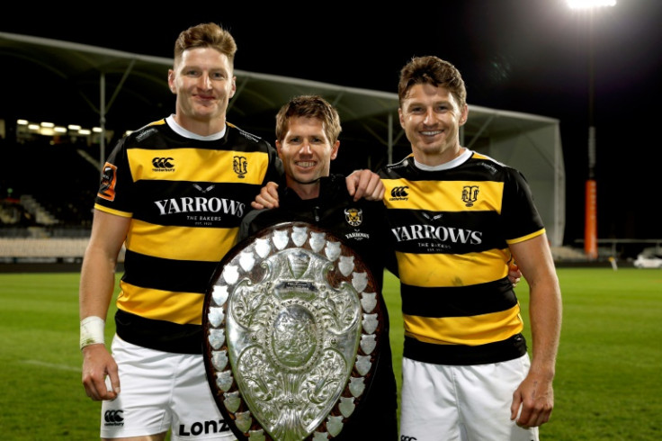Jordie Barrett (left) and Beauden Barrett with Tim Stuck (centre), the principal at Francis Douglas Memorial College, where all five Barrett brothers went to school