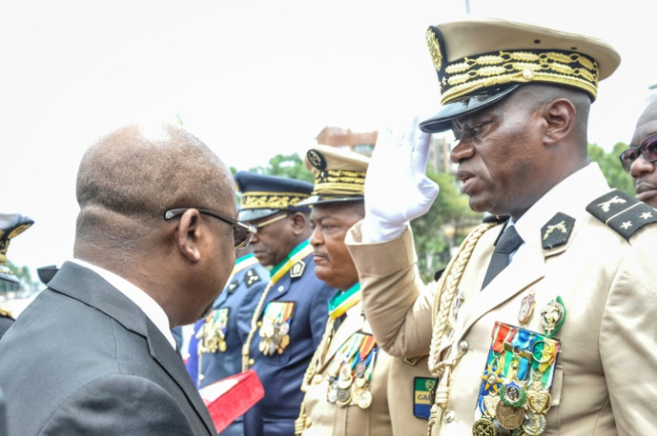 Head of Gabon's Republican Guard, General Brice Oligui Nguema (R), will be sworn in as transitional president on Monday