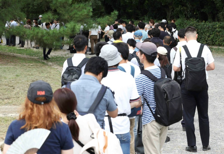 Members of the Japanese public wait in line for tickets to attend the trial of Shinji Aoba, defendant in the Kyoto Animation arson murder