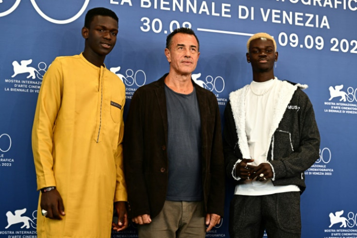 Garrone with 'Io Capitano' stars Seydou Sarr and Moustapha Fall