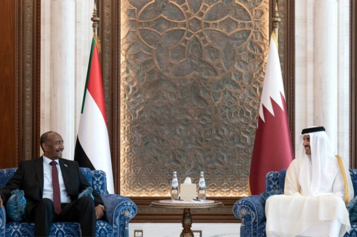 Qatar's Emir Sheikh Tamim bin Hamad Al Thani (R) meets with Sudan's army chief Abdel Fattah al-Burhan in Doha