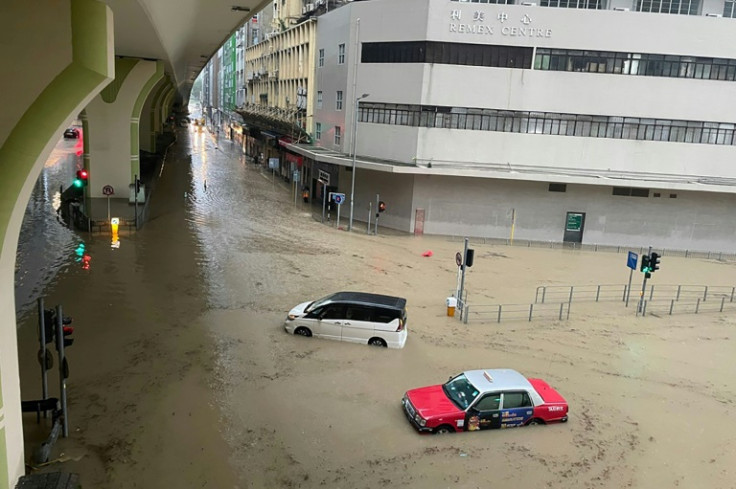 Record rainfall in Hong Kong caused widespread flooding Friday, disrupting road and rail traffic just days after the city dodged major damage from a super typhoon