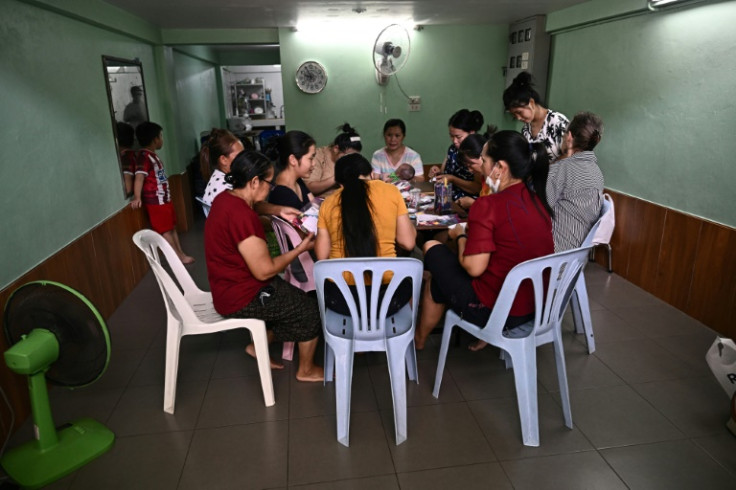 Vietnamese Hmong women take part in an embroidery workshop in Bangkok