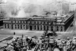 Chilean soldiers attack the presidential palace where socialist president Salvador Allende was holed up