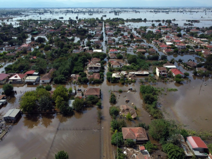 Several houses remain under water in the village of Palamas
