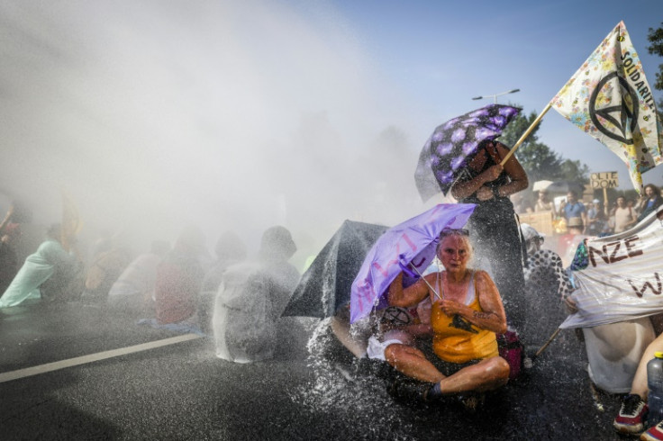 Protesters came prepared with umbrellas and waterproof clothing
