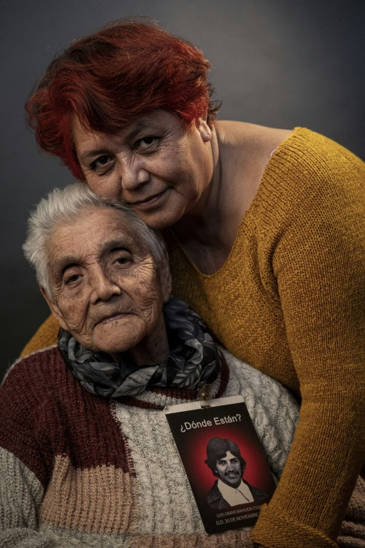 Elsa Esquivel, the 83-year-old mother of a man who went missing under the Pinochet regime, poses with her daughter Marialina Gonzalez
