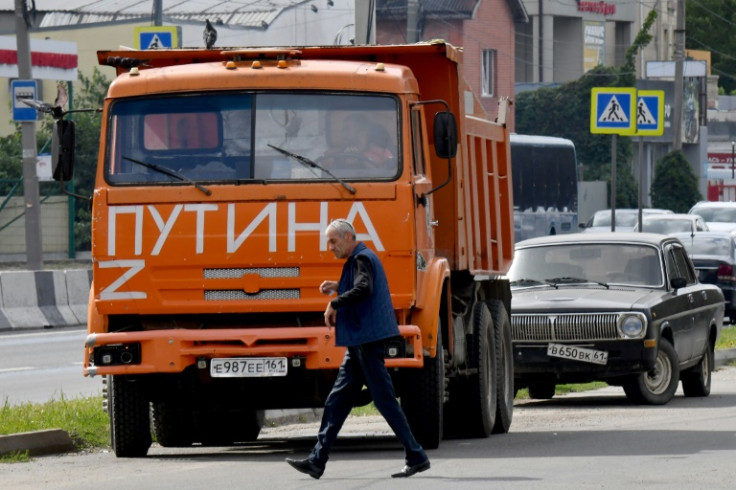 The polls take place as Moscow has forced President Vladimir Putin's opponents into exile or jail and with criticism of the military campaign outlawed