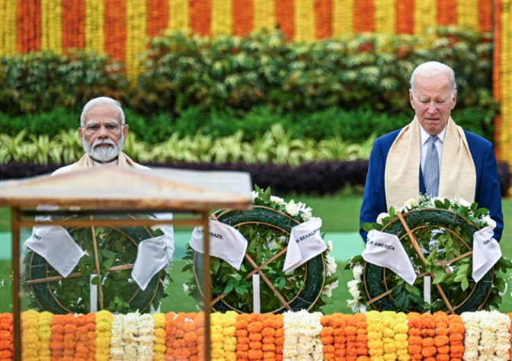 India's Prime Minister Narendra Modi and US President Joe Biden pay their respects at the Mahatma Gandhi memorial