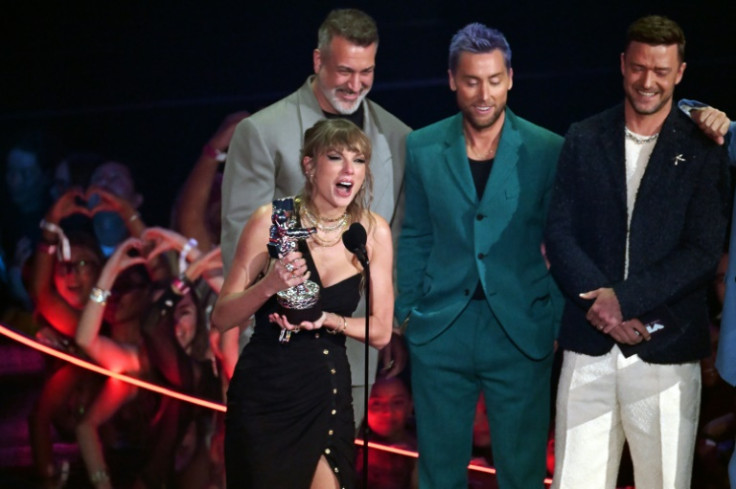 Taylor Swift accepts the award for Best Pop Video, presented by a reunified NSYNC