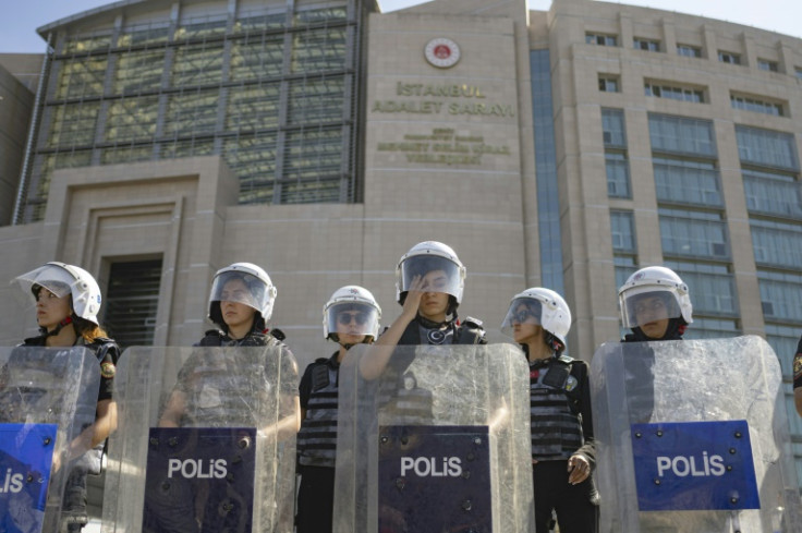 Riot police cordoned off the courthouse and detained two supporters of the campaign group ahead of the closely watched hearing