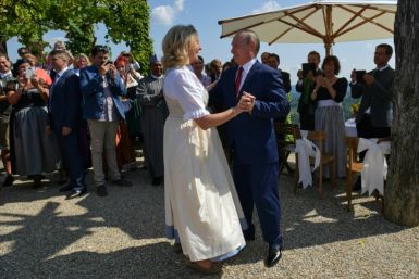 Kneissl and Putin dancing at her wedding in 2018