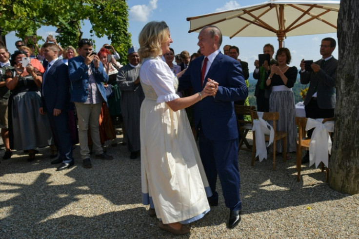 Kneissl and Putin dancing at her wedding in 2018