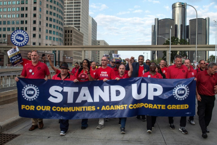 United Auto Workers members march through the streets of downtown Detroit on the first day of the union's strike