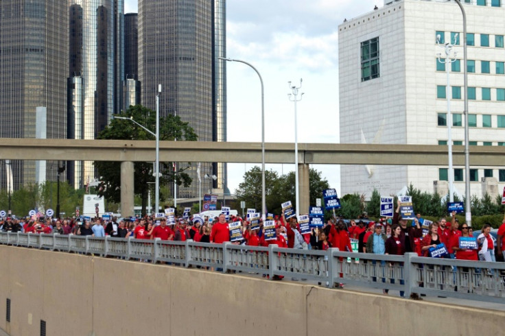 Members of the United Auto Workers (UAW) union march through the streets of downtown Detroit following a rally on the first day of the UAW strike in Detroit, Michigan, on September 15, 2023