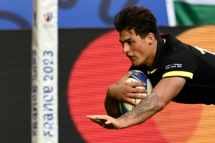 Louis Rees-Zammit dives over to score Wales' first try in their World Cup victory against Portugal