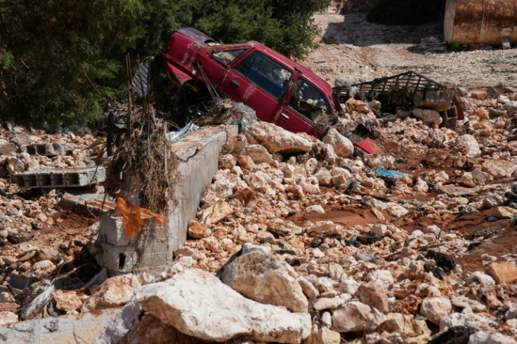 A car buried in post-flood rubble and debris in Al-Bayda in eastern Libya