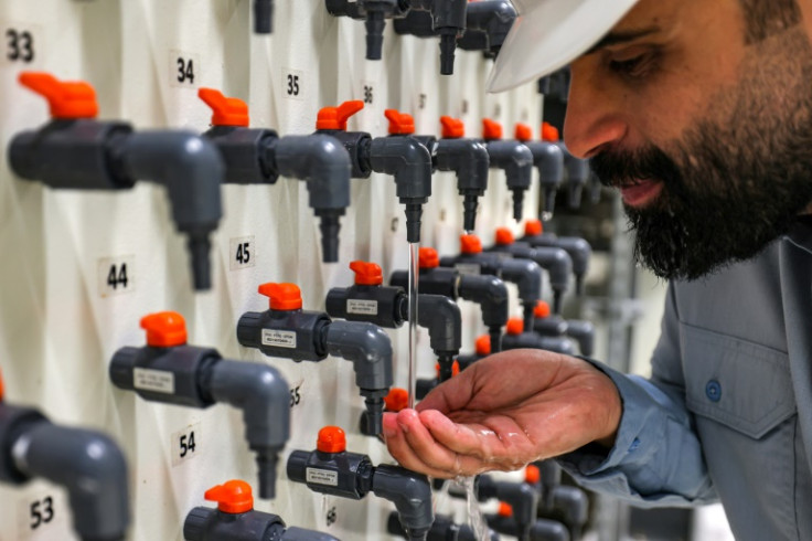 General manager Mohamed Ali al-Qahtani checks the quality of the ouput at the Ras al-Khair desalination plant