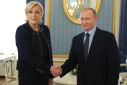 Marine Le Pen, seen here in Moscow with Vladimir Putin, has regularly been accused of supporting the Kremlin's positions