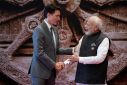 India's Prime Minister Narendra Modi (R) shakes hands with Canada's Prime Minister Justin Trudeau ahead of the G20 Leaders' Summit in New Delhi on September 9, 2023
