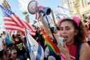 A protestor chants slogans during a demonstration in front of the US embassy building in Tel Aviv, as Israel's Prime Minister Benjamin Netanyahu meets President Joe Biden in New York