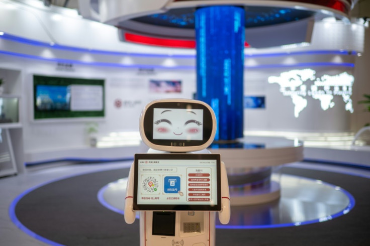 A robot greets visitors at a bank in the Asian Games media centre