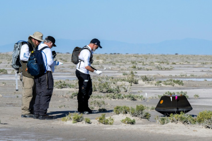 Scientists collect data shortly after the sample return capsule from NASA's Osiris-Rex mission landed in Dugway, Utah