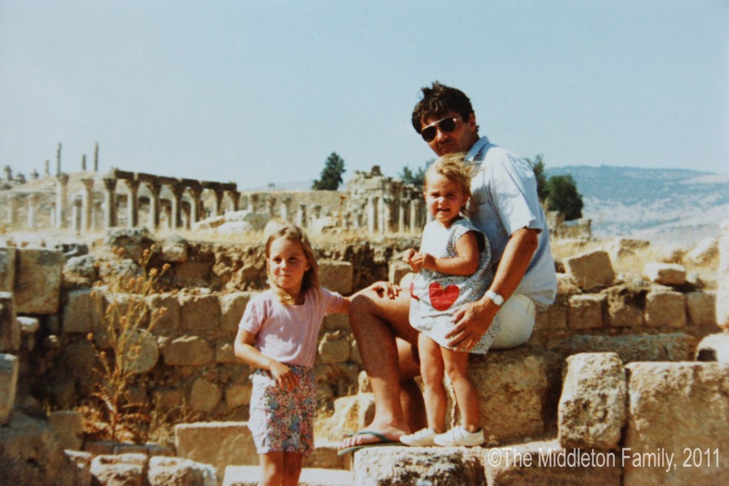 Kate Catherine aged four with her father and sister Pippa in Jerash, Jordan.