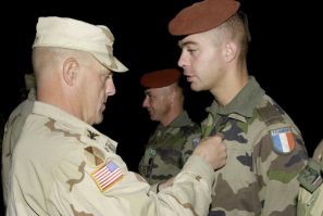 Mark Milley, a colonel at the time, awards a medal to a French soldier in Afghanistan in October 2003