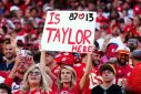 A Taylor Swift fan holds up a sign at the Kansas City Chiefs' NFL home win over the Chicago Bears, where Swift's attendance caused a stir