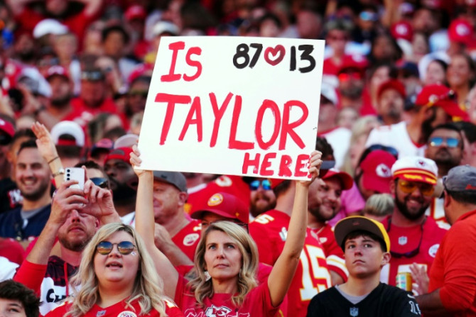 A Taylor Swift fan holds up a sign at the Kansas City Chiefs' NFL home win over the Chicago Bears, where Swift's attendance caused a stir